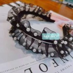 Pinza con forma de mariposa con perlas